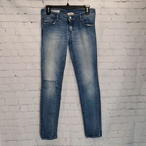 Cycle skinny jeans with distressed knee